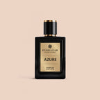 AZURE by Evorazar – black parfum bottle with gold label on a beige background